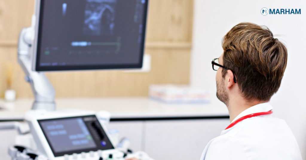 Ultrasound technician analyzing the sonology screen
